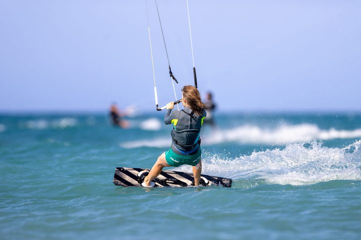 a person kiteboarding on a body of water