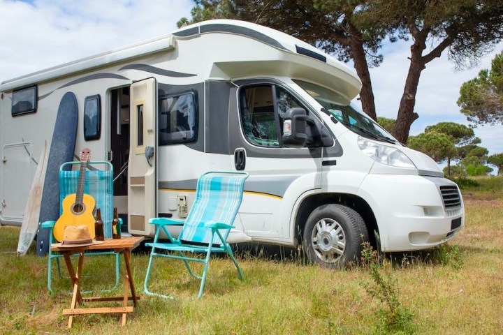 an rv parked in the grass